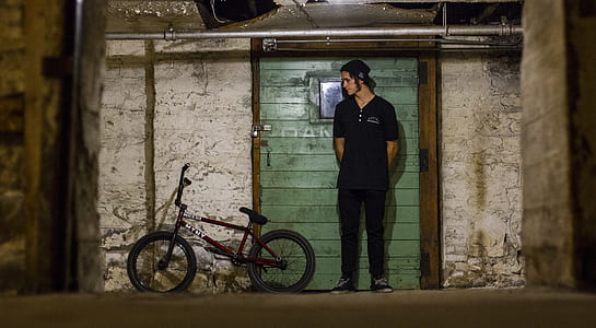 man standing near BMX bike thumbnail