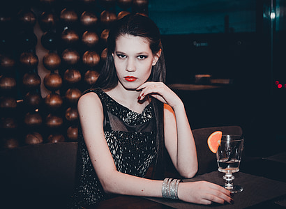 woman wearing black sleeveless dress thumbnail