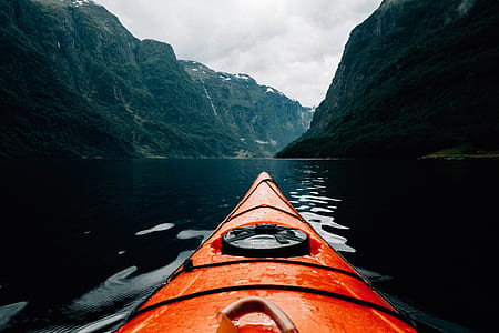 orange kayak on clear river thumbnail