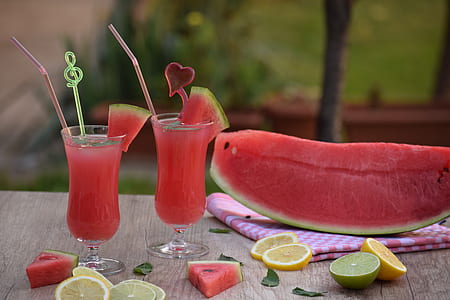 slice of watermelon and fruit cocktails on top of table thumbnail