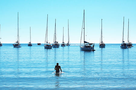 person on body of water during daytime thumbnail