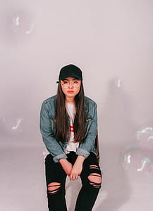 woman wearing blue chambray jacket and black distressed jeans thumbnail