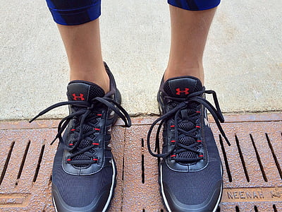 person wearing black Under Armour lace-up sneakers thumbnail