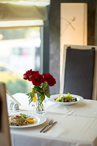 Close-up Photo of Three Red Roses in Clear Vase Centerpiece thumbnail