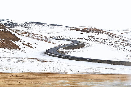 curved road on a snow-covered hill thumbnail