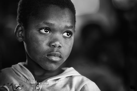black and white photo of boy in white full-zip hoodie top thumbnail