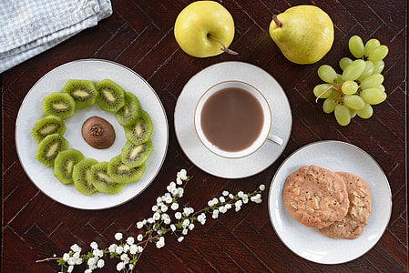 Overhead shot of fruit, coffee and biscuits thumbnail