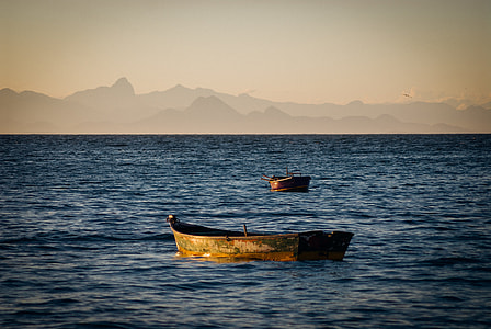 photo of two jon boat sailing on sea thumbnail