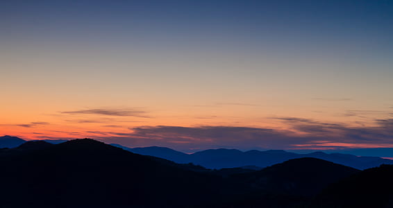 silhouette photo of mountain with sunset thumbnail