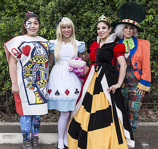four women wearing Alice in Wonderland cosplay thumbnail
