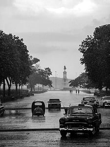 vehicles on road while raining thumbnail