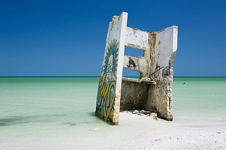 yellow and green mural near body of water thumbnail
