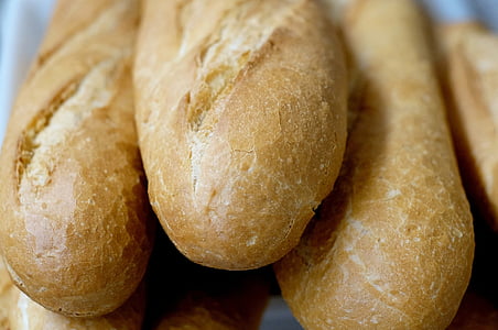 pile of baguettes selective-focus photography thumbnail