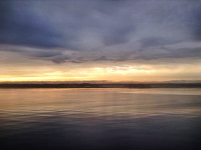 calm body of water under golden hour thumbnail
