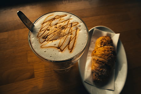 oval white ceramic plate with bread on top near frappe thumbnail