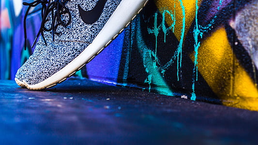 person in grey Nike running shoe thumbnail