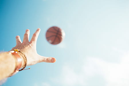 A basketball throw with clear sky in the background thumbnail
