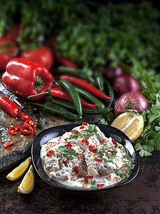 cooked food beside chili and peppers thumbnail