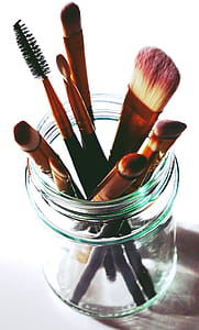 makeup brushes in clear glass jar thumbnail