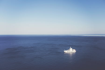 white yacht on body of water thumbnail
