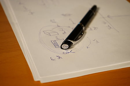 photo of black pen on top of printing paper thumbnail