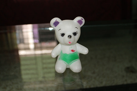 white bear ceramic figurine on glass surface thumbnail