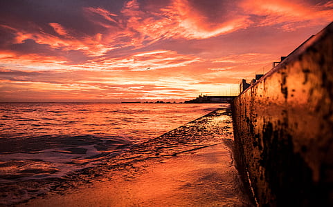 body of water on seashore thumbnail