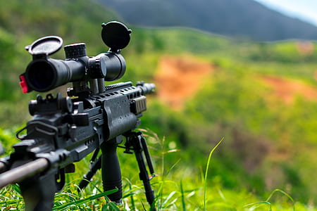 photo of black rifle with black scope thumbnail