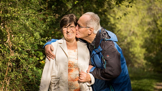 man kissing woman on cheek thumbnail