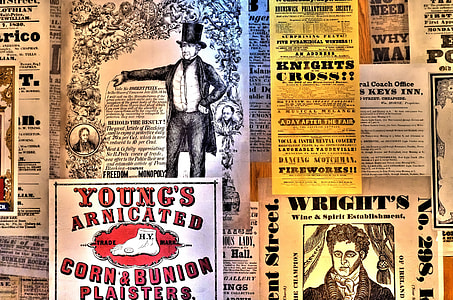 assorted posters on wall thumbnail