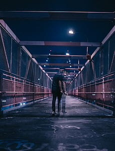 time lapse photography of man and woman on bridge thumbnail