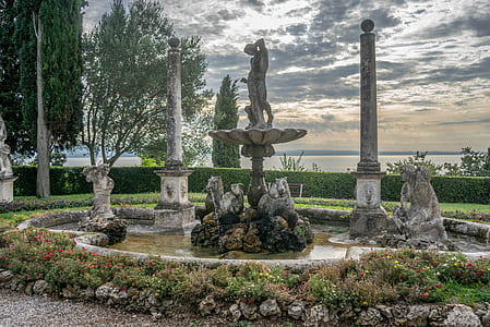 water fountain near bush thumbnail