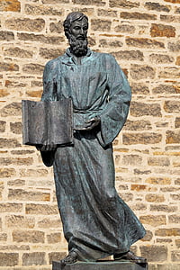 statue of man under sunny sky thumbnail