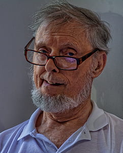 man wearing eyeglasses and gray collared top thumbnail
