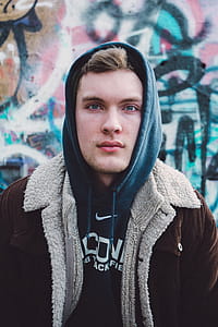 Man Wearing Blue Nike Pullover Hoodie thumbnail