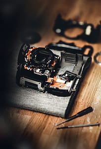 black and gray electronic device on brown surface thumbnail