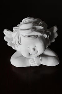 white ceramic cherub figurine thumbnail