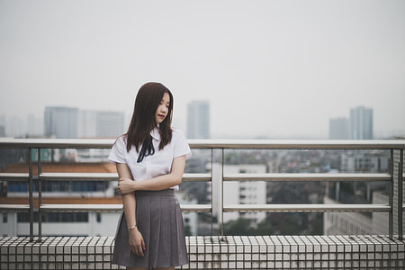 woman standing on top of building roof top thumbnail