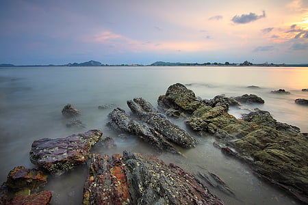 gray stone on body of water thumbnail