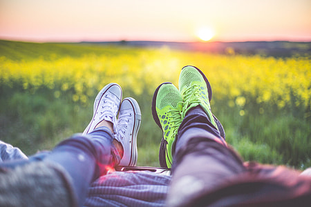 Young Couple Relaxing & Enjoying The Sunset from The Car thumbnail