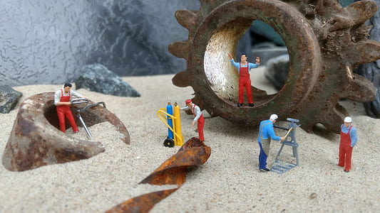 close-up photography of five men in assorted-color overalls figurines thumbnail
