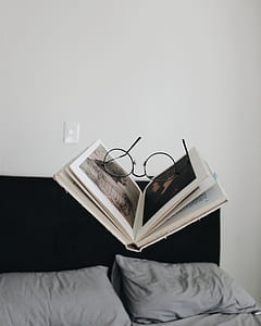 eyeglasses on top of open book thumbnail