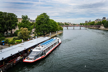 white and red ship in docking bay during daytime thumbnail