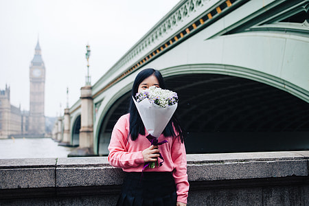 woman holding bouquet near charles bridge thumbnail