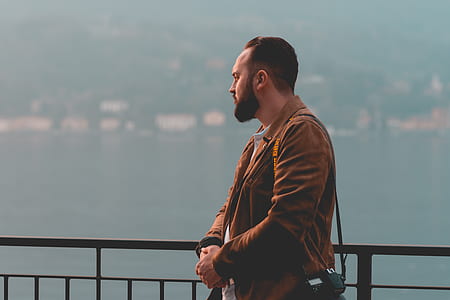 man standing near metal railings thumbnail