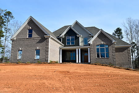 gray concrete house during daytime thumbnail