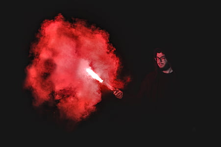 person holding red flare thumbnail