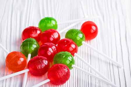 green and red lollipops on white surface thumbnail