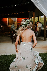 woman standing on grass field thumbnail