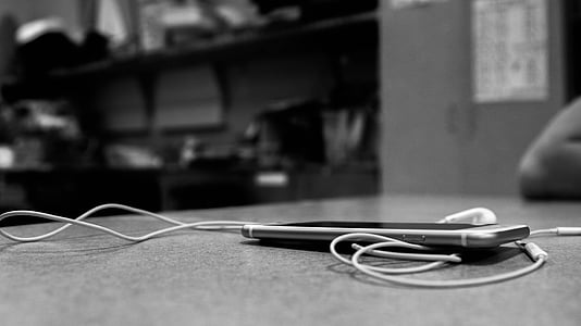 smartphone and earphones on the table thumbnail